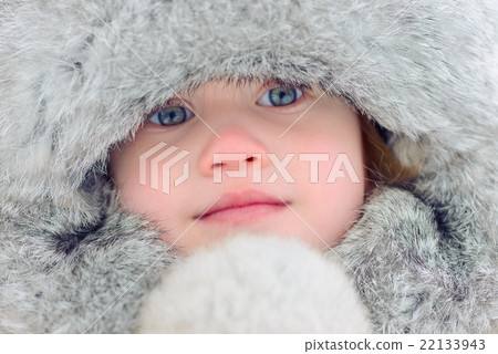 Child in a fur cap. Close up portrait. Blue eyes Child in a fur cap. Close up portrait. Blue eyes 22133943