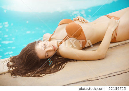 sexy girl lying at a pool 22134725