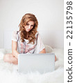 Woman sitting on the sofa with laptop. Woman sitting on the sofa with laptop. 22135798