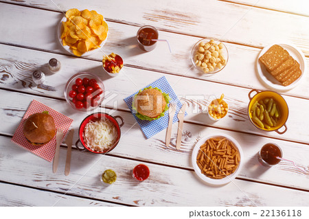 Burgers, potato chips and pickles. Burgers, potato chips and pickles. 22136118