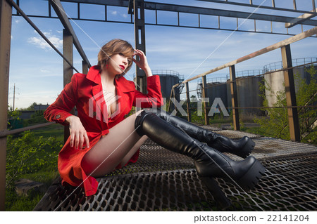 Attractive woman alluring in lingerie and coat. Attractive woman alluring in lingerie and coat. 22141204