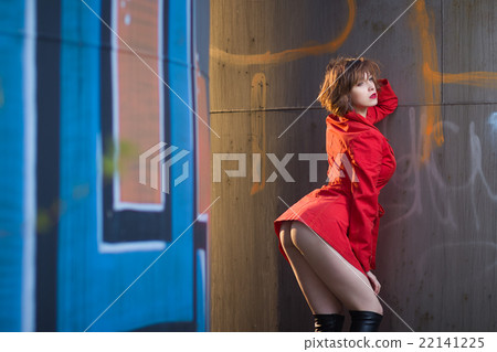 Attractive woman alluring in lingerie and coat. 22141225