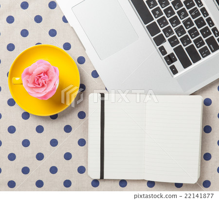 Cup and notebook near laptop comuter Cup and notebook near laptop comuter 22141877