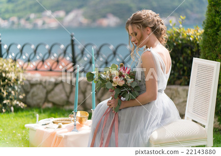 beautiful young bride on a lawn poses for photo beautiful young bride on a lawn poses for photo 22143880