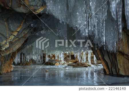 Multicolored stone grotto with icicles. 22146140