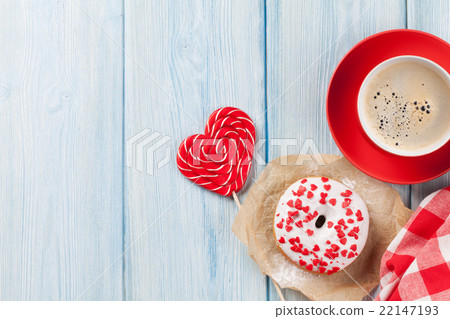 Donut, heart shaped candy and coffee 22147193