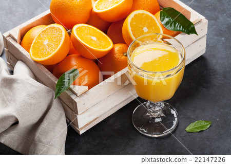 Fresh orange fruits and juice Fresh orange fruits and juice 22147226