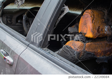 Burned gray car. 22149084