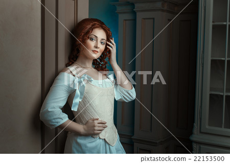 Girl in retro dress flirts looks. 22153500