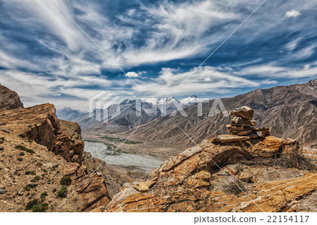 View of valley in Himalayas with stone cairn on 22154117