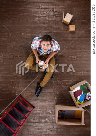 Top view photo of man on wooden floor Top view photo of man on wooden floor 22155209