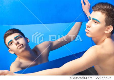 Handsome male with reflection in mirror 22156696