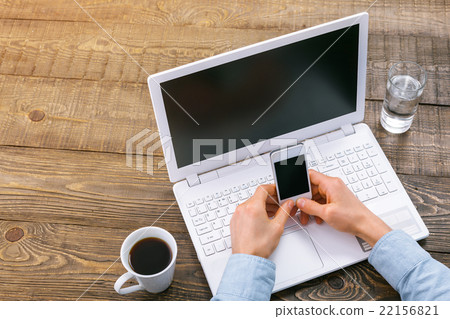 Top view of objects and hands on table Top view of objects and hands on table 22156821