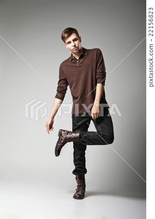 Young male fashion model posing in casual outfit Young male fashion model posing in casual outfit 22156823