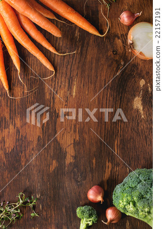 Wooden background with vegetables Wooden background with vegetables 22157191