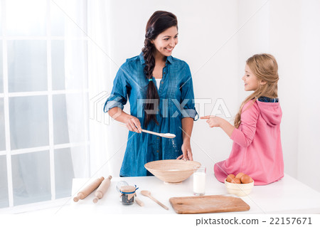 Happy mother and daughter baking Happy mother and daughter baking 22157671