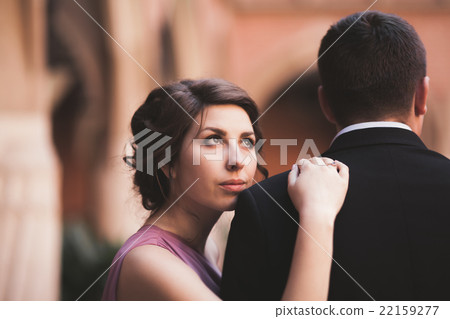 Young couple in love bride and groom posing near Young couple in love bride and groom posing near 22159277