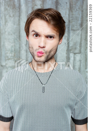 Studio shot of young stylish man Studio shot of young stylish man 22159369