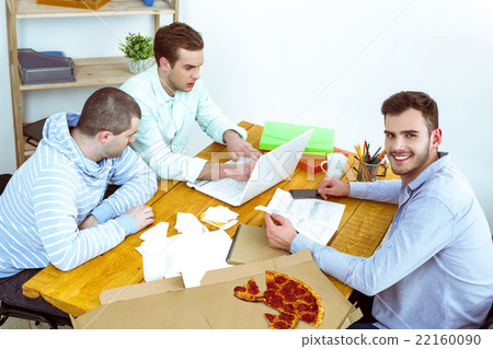 IT programmers working with laptop 22160090