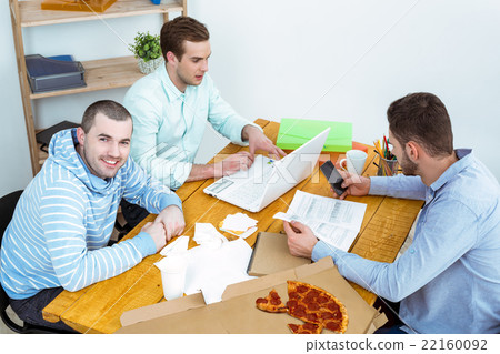 IT programmers working with laptop 22160092