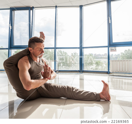 Athletic muscular young man working out, yoga 22169365