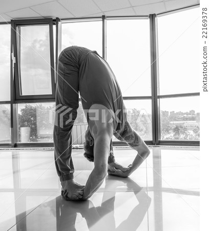 Athletic muscular young man working out, yoga Athletic muscular young man working out, yoga 22169378