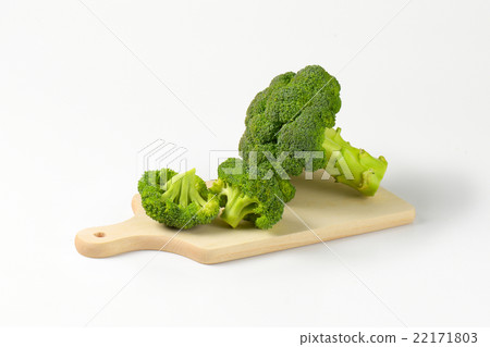 Fresh broccoli on cutting board 22171803