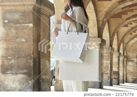 A woman with a shopping bag 22175770