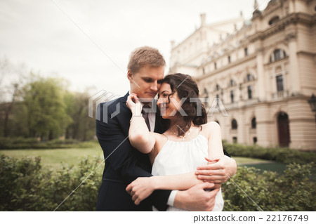 Beautiful wedding couple, bride, groom kissing and Beautiful wedding couple, bride, groom kissing and 22176749