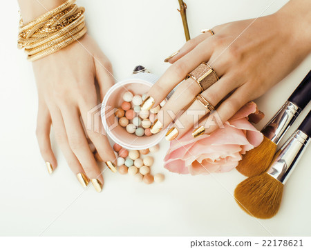 woman hands with golden manicure and many rings woman hands with golden manicure and many rings 22178621