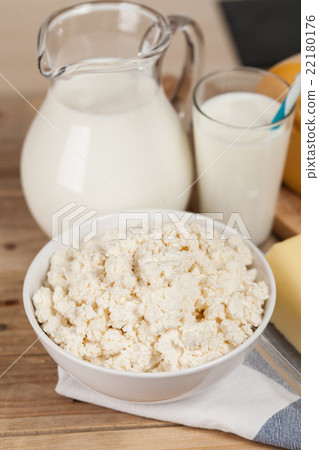 Milk jar on wooden table Milk jar on wooden table 22180176