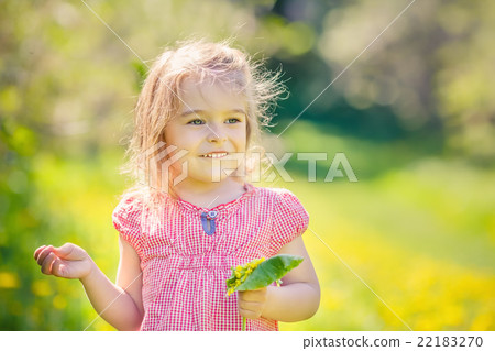 Happy little girl in spring sunny park Happy little girl in spring sunny park 22183270