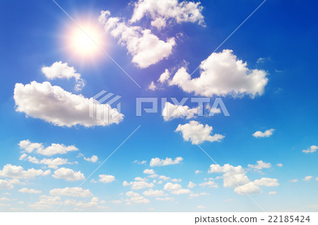 sun on blue sky with white clouds 22185424