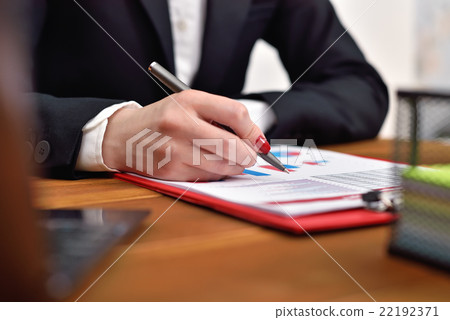 woman checks the start up report woman checks the start up report 22192371