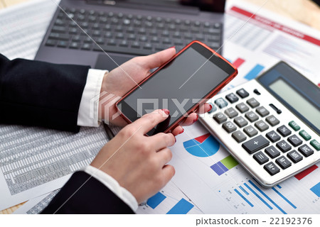 businesswoman holding cellphone in hand businesswoman holding cellphone in hand 22192376