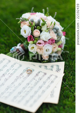Wedding rings on a sheet of paper with notes 22192439