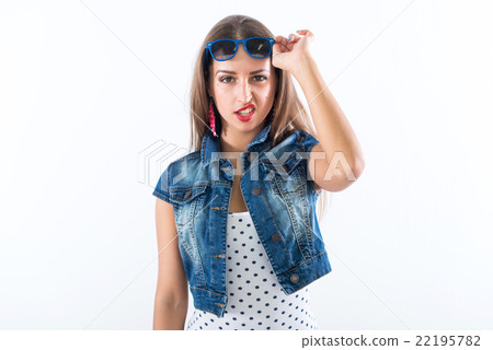 Studio portrait of a playful girl having fun Studio portrait of a playful girl having fun 22195782