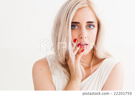 Surprised shoked girl covers her mouth 22201750