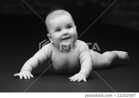 Beautiful baby on a black background 22202087