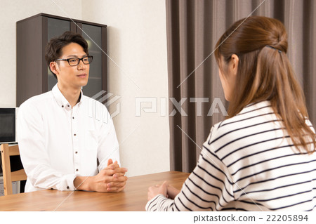 Young couple discussing Young couple discussing 22205894