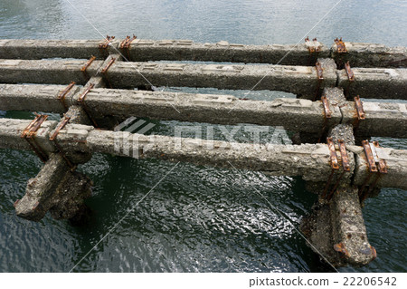 Concrete pier corroded by salt in the sea Concrete pier corroded by salt in the sea 22206542