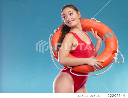 Lifeguard woman on duty with ring buoy lifebuoy. 22206644