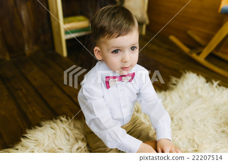 Boy sitting on fur Boy sitting on fur 22207514
