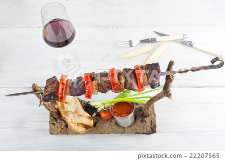 skewers on a wooden background skewers on a wooden background 22207565