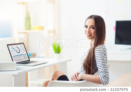Positive woman working in the office    22207970