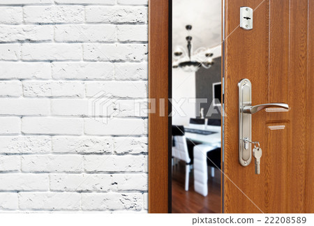 Half open door of a modern kitchen closeup. Half open door of a modern kitchen closeup. 22208589