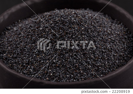 poppy seeds in a stone bowl poppy seeds in a stone bowl 22208919