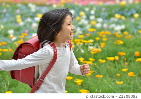 Girl running in flower garden (school bag) 22209082