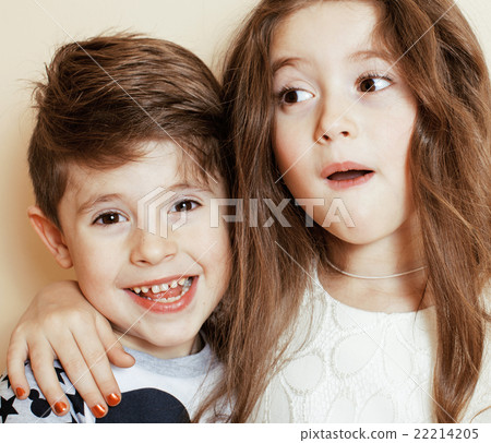 little cute boy and girl hugging playing on white little cute boy and girl hugging playing on white 22214205