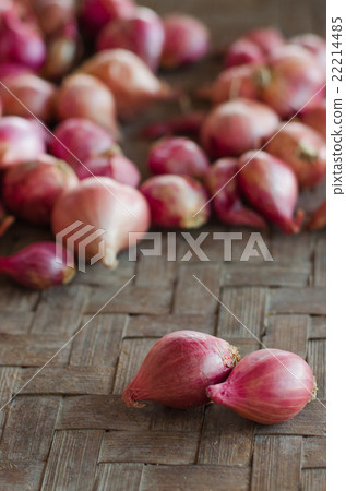 Two shallots on blurred shallots background. 22214485